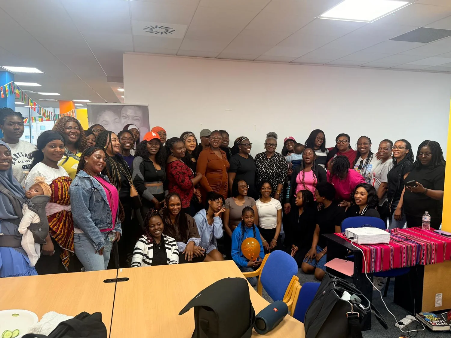 Women and families gathered together at an AWSN event